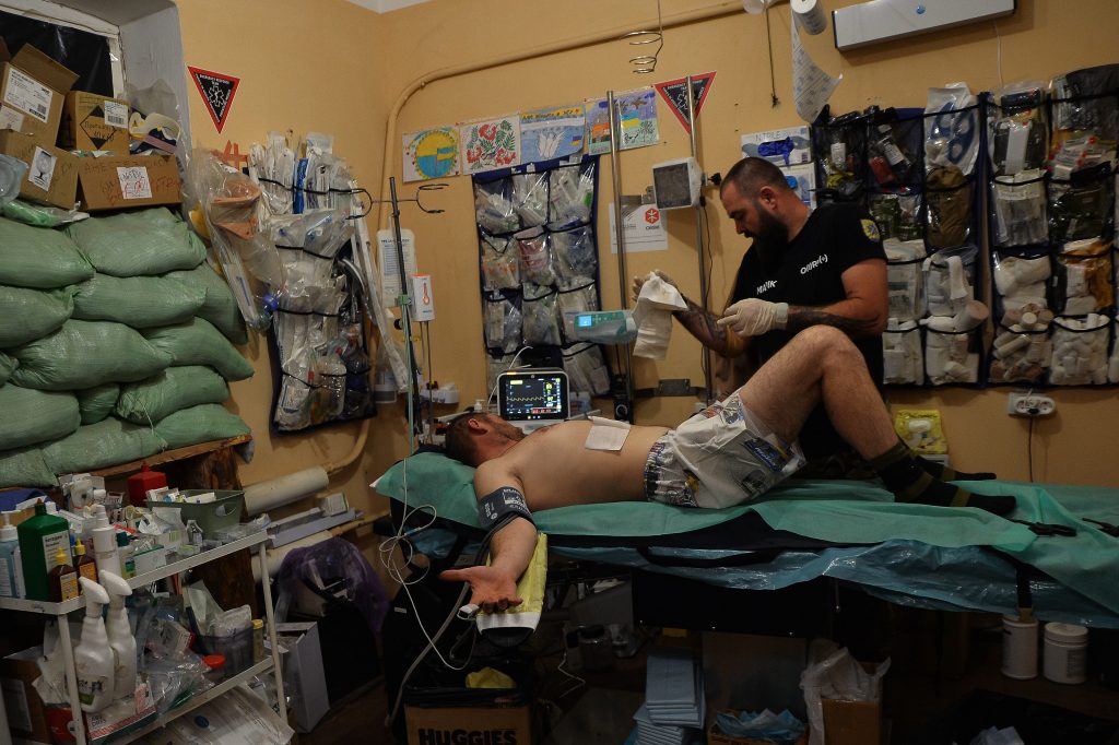 Forgotten On the Line ruslan, a ukrainian solider, reeceives treatment following an fpv attack